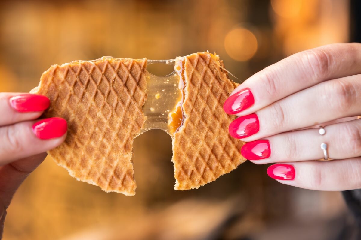 Stroopwafel being pulled apart showing the delicious inside