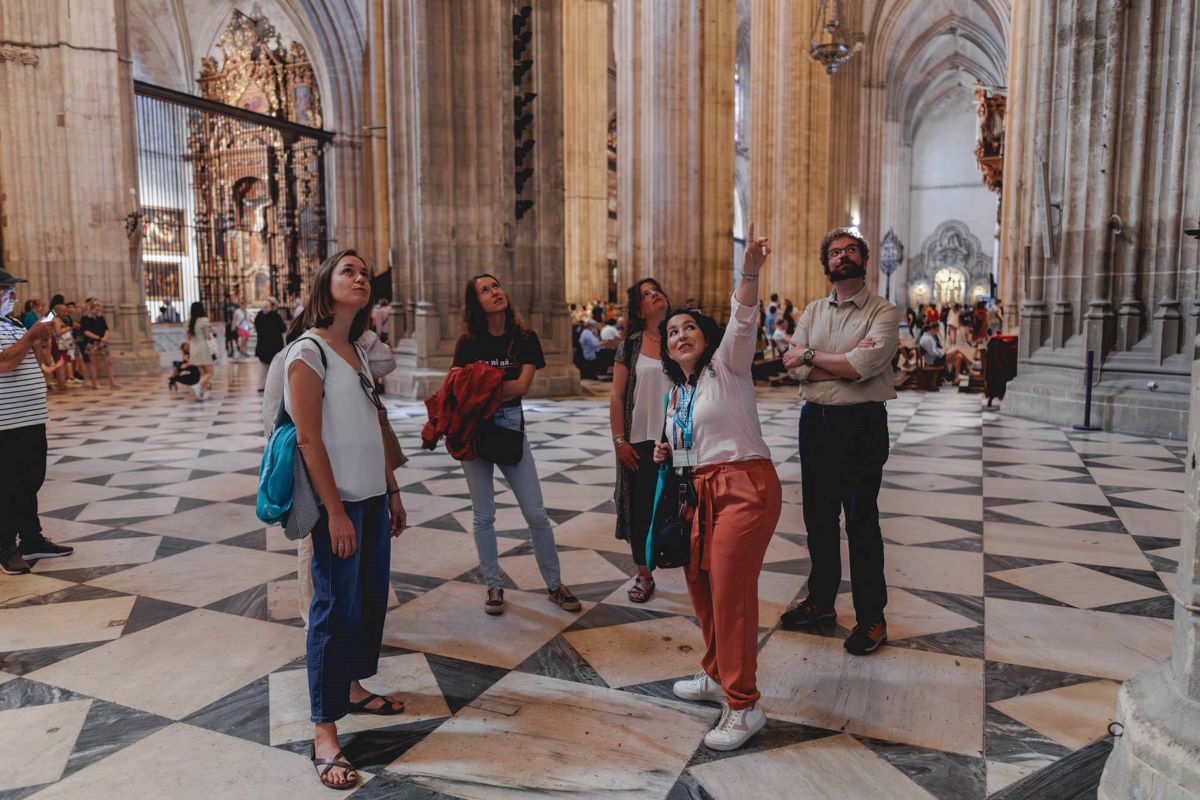 A group of people visiting the Seville Cathedral 