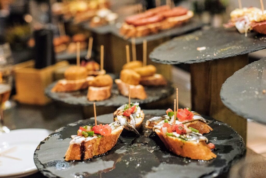 7 Most Popular Tapas in Barcelona Bombas, Bravas, Buñuelos & More Devour Tours
