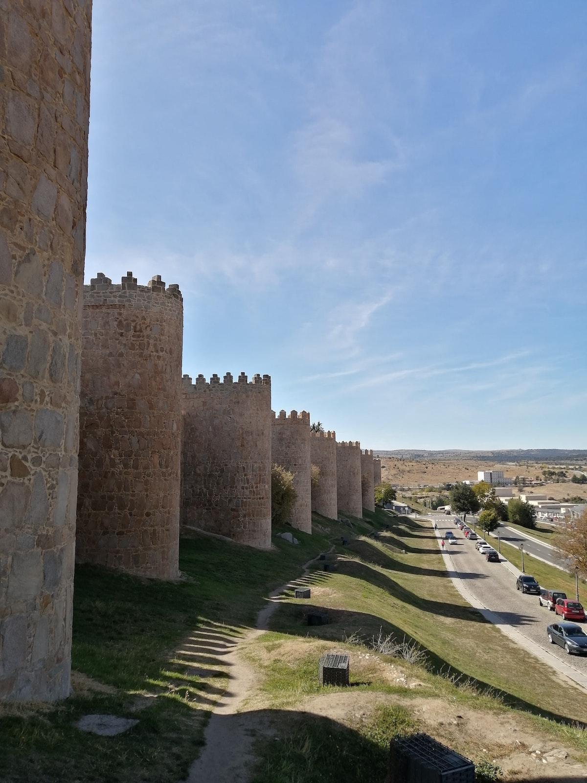 Exterior view of medieval-era city walls in Spain.