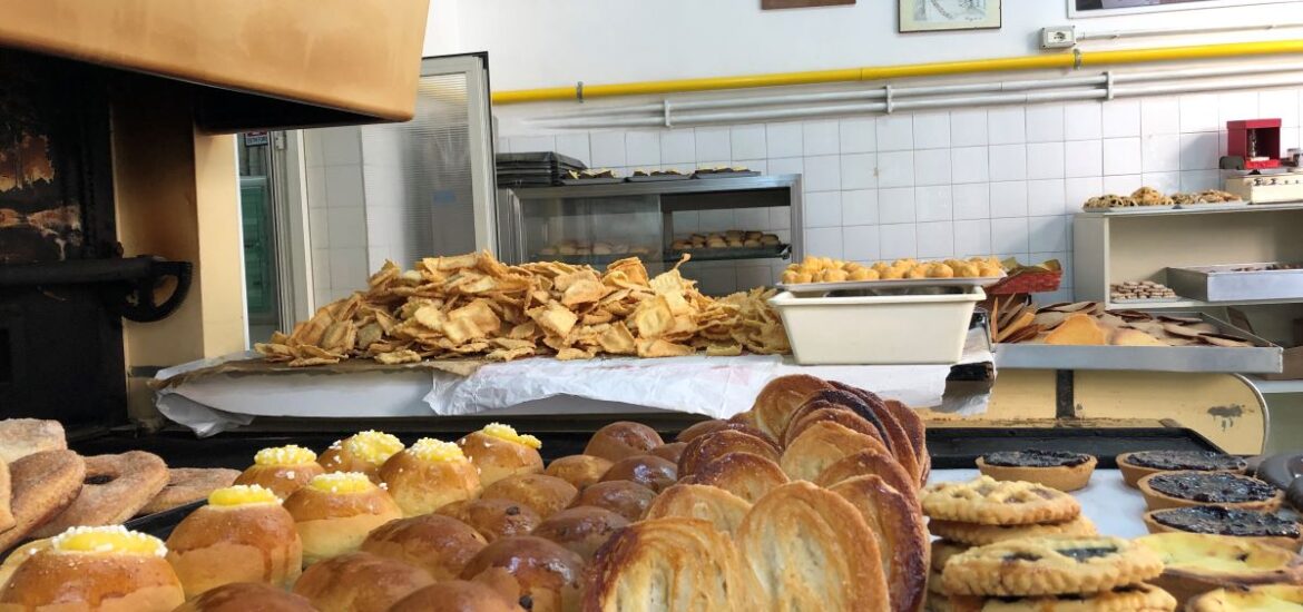 large baking sheet filled with pastries in pastry shop