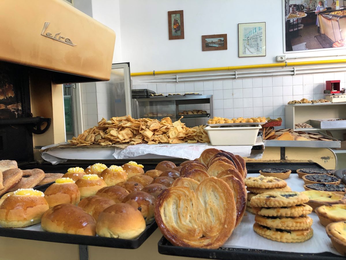 large baking sheet filled with pastries in pastry shop
