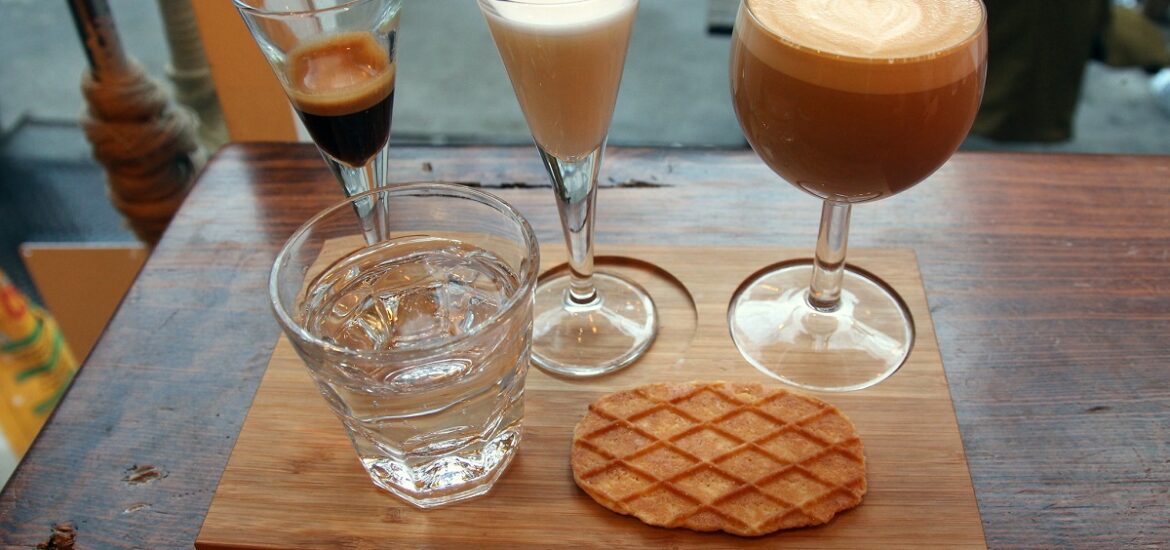 Deconstructed latte at Coffee Project NYC with water and wafer