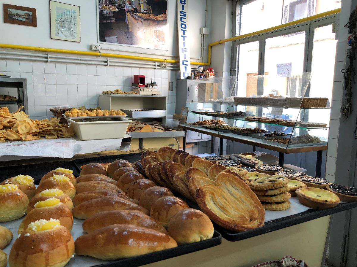 large baking sheet filled with pastries in pastry shop