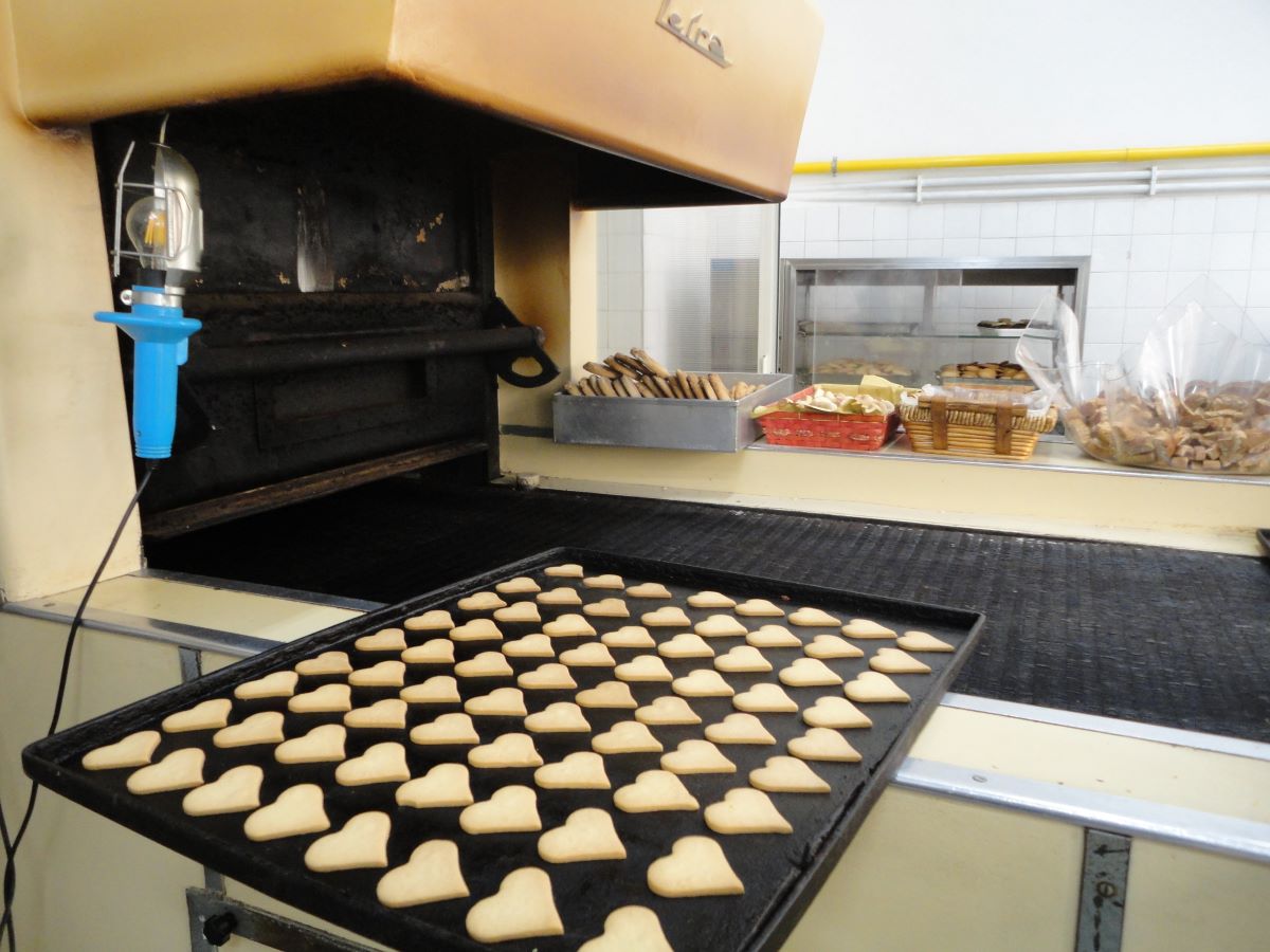 sheet pan filled with heart-shaped cookies