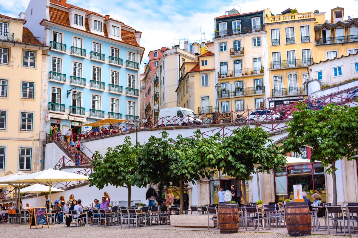 People enjoying restaurants in Lisbon in September. 