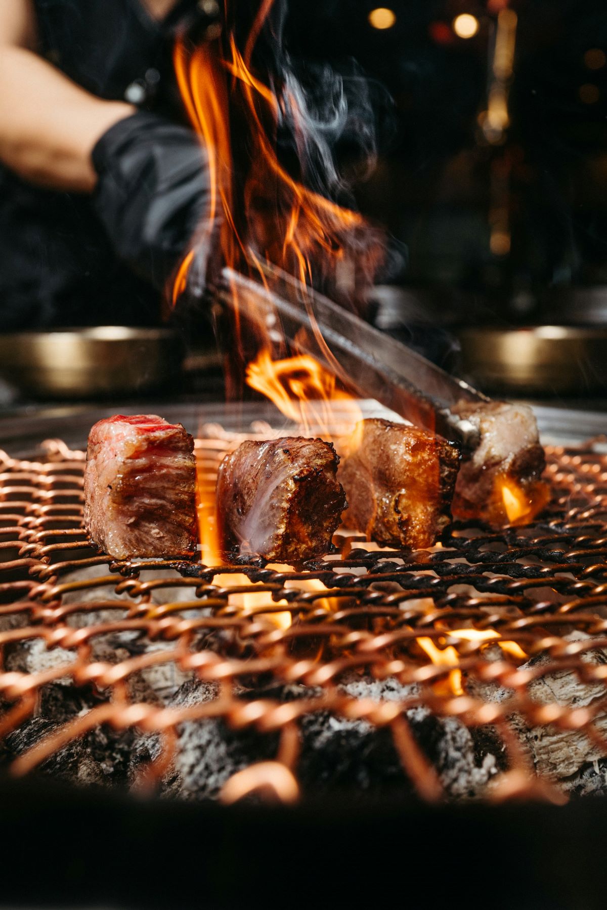 Koryo Saram style meats being cooked on an open flame. 