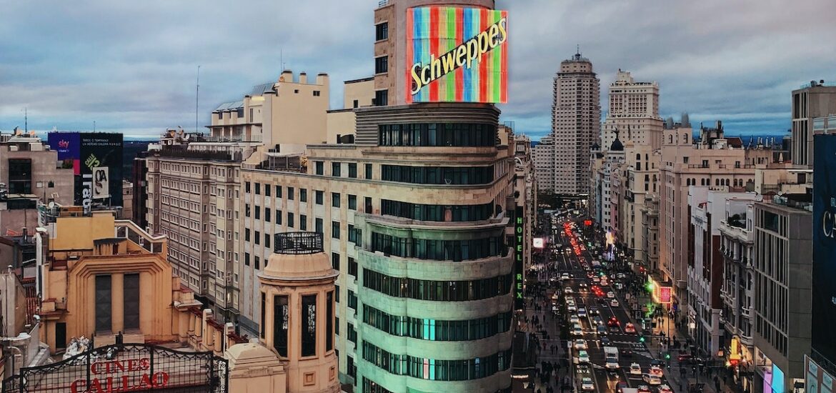 View of a busy city street in downtown Madrid as seen from above.