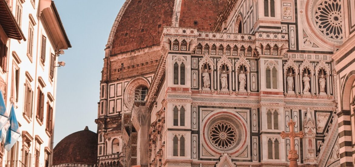 Crowds of tourists surround the Duomo in Florence on a sunny summer day