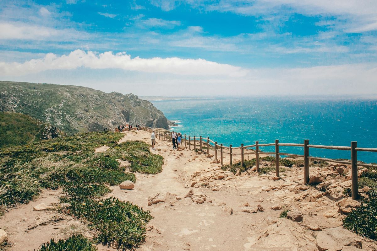 People hiking around Cabo da Roca on a sunny day. 