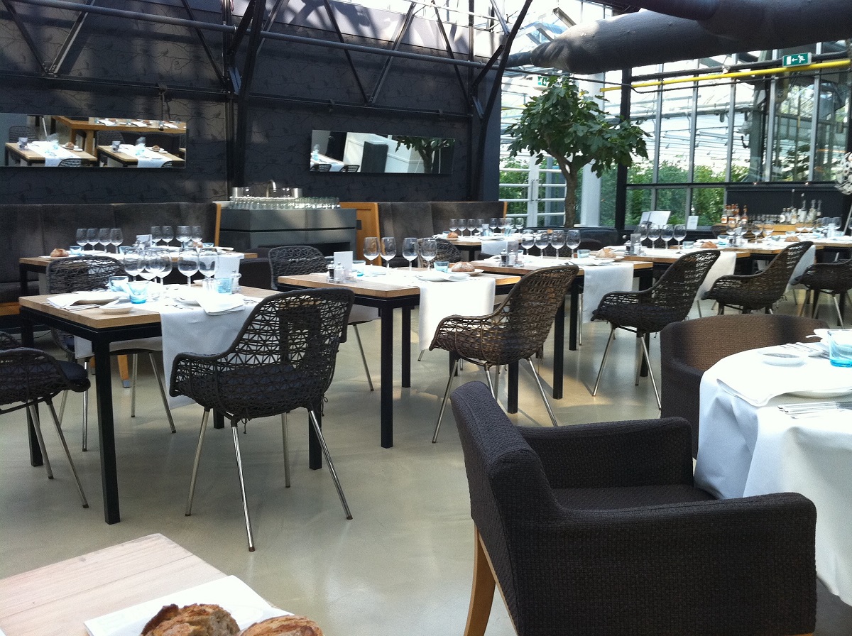 Interior of de Kas restaurant in Amsterdam inside of a greenhouse