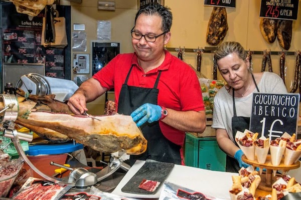 Ham stall at a Seville market