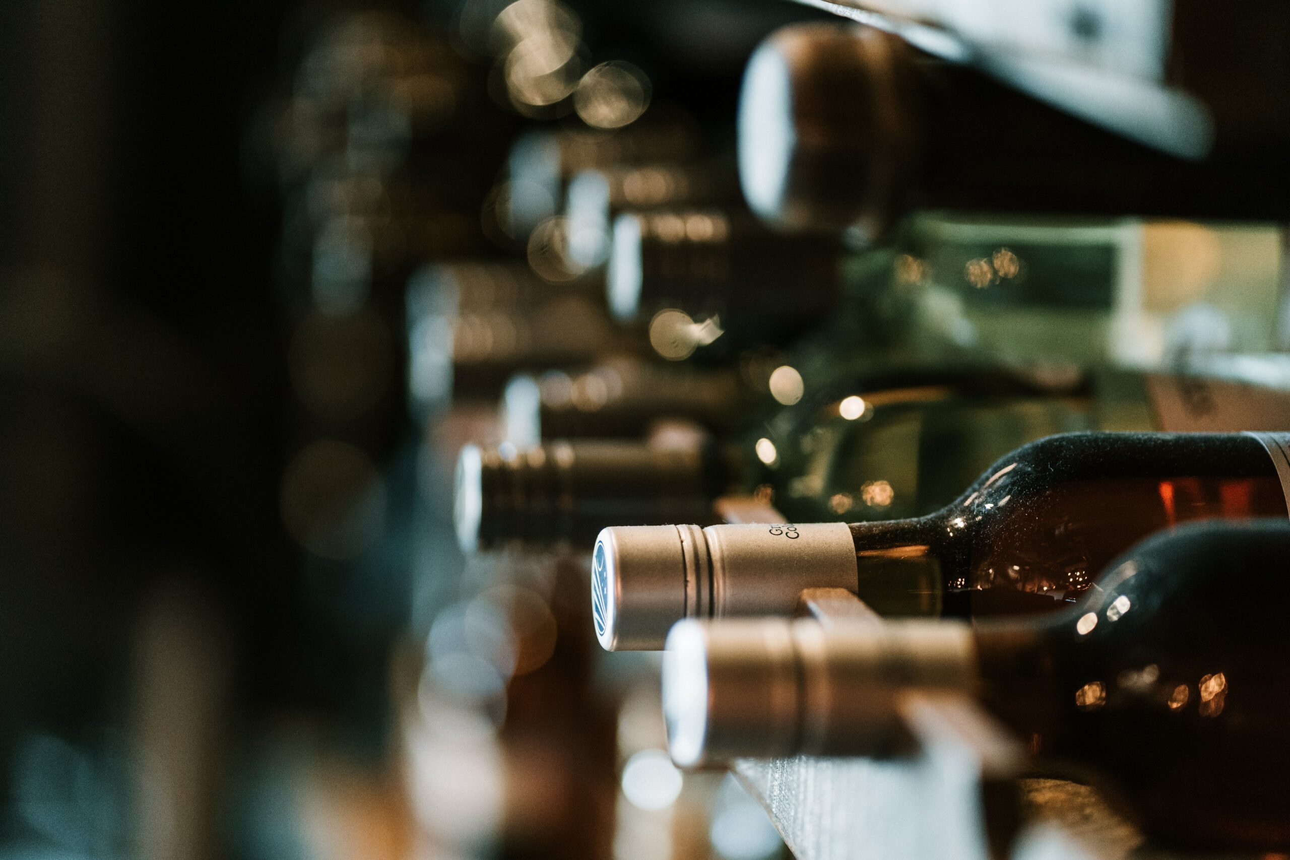 Wine bottles being stored in a wine cellar