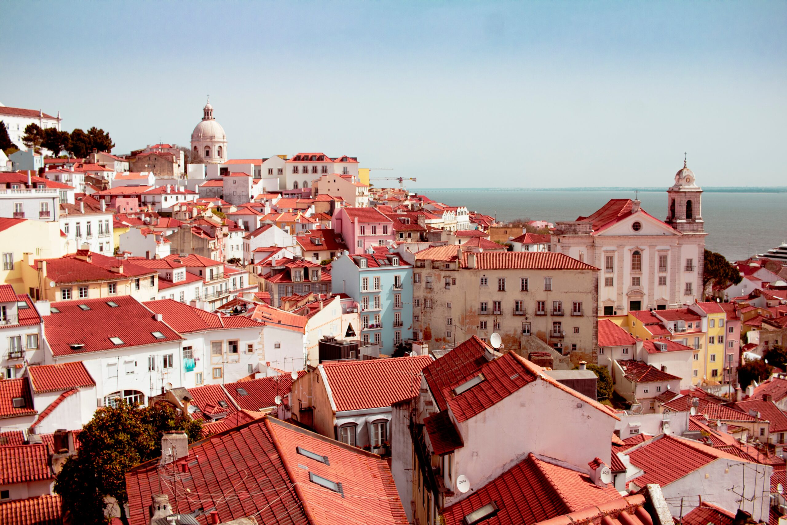 The rooftops of Alfama, Lisbon with the sea in the background 