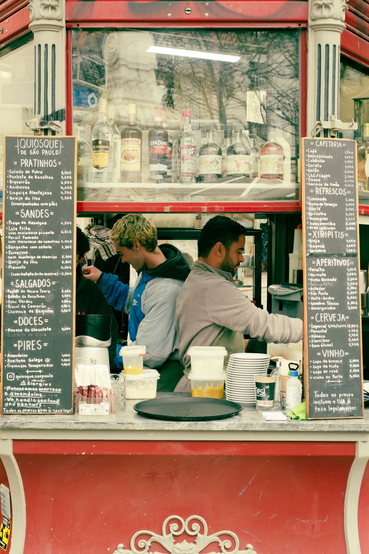 Two men working at a kiosk in Lisbon. 