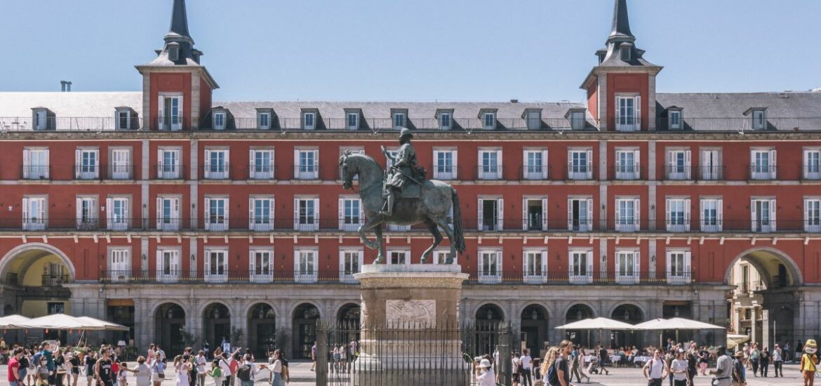 people walking in Plaza Mayor in Madrid