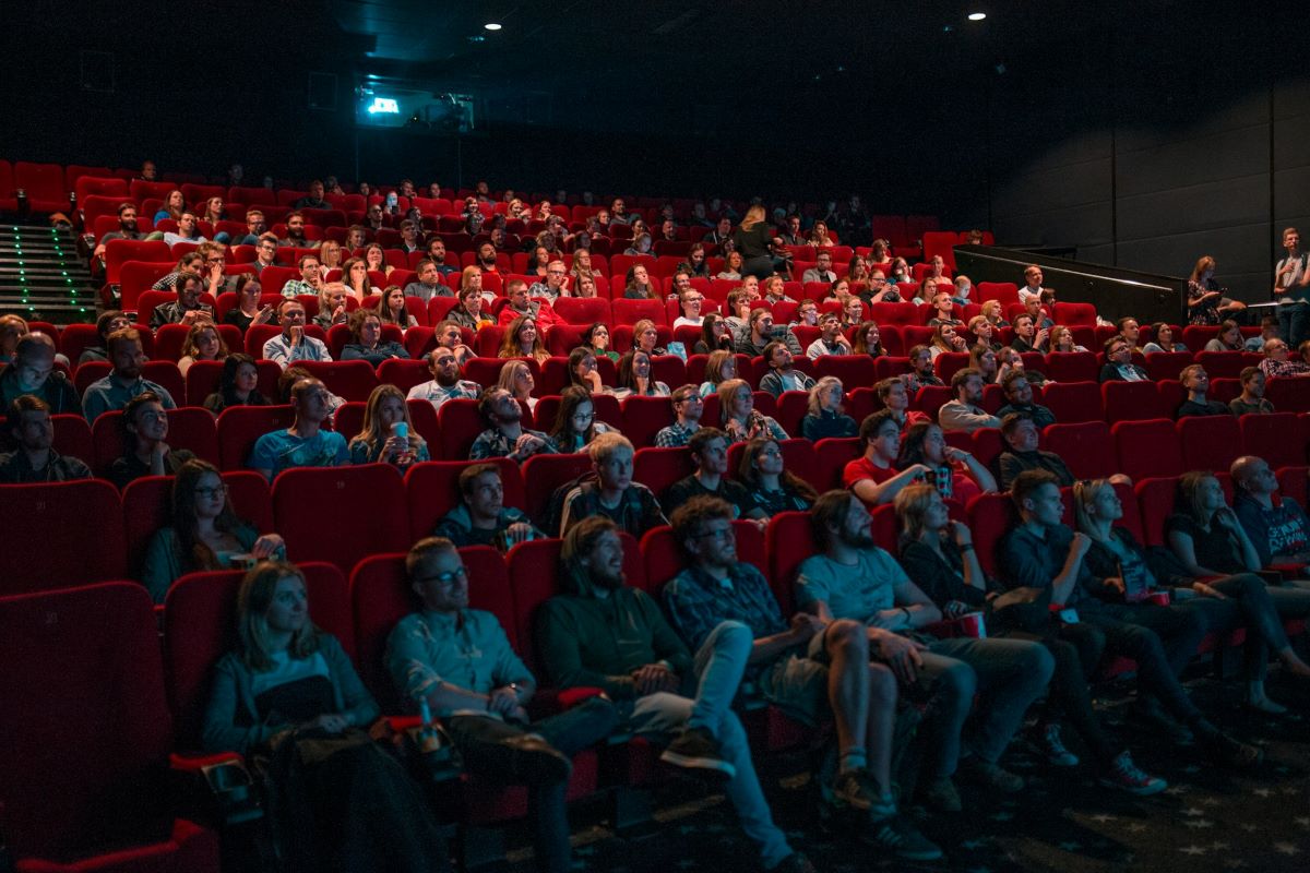 People sitting inside a movie theater participating in the Sebastian International Film Festival.