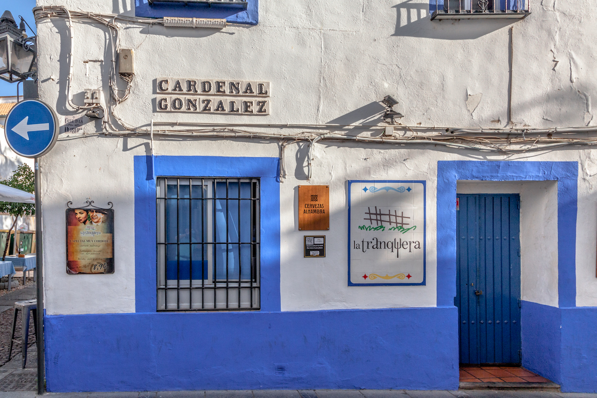 Blue and white exterior of a two-story restaurant building.