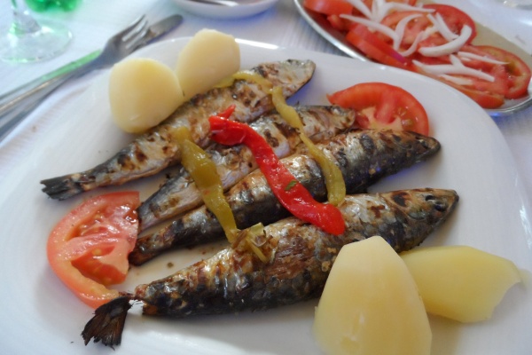 A dish of grilled sardines with grilled peppers and boiled potatoes at a tasca in Lisbon.