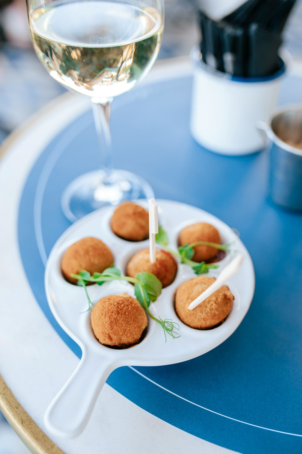 A small appetizer, petiscos, on a ceramic plate in Lisbon.