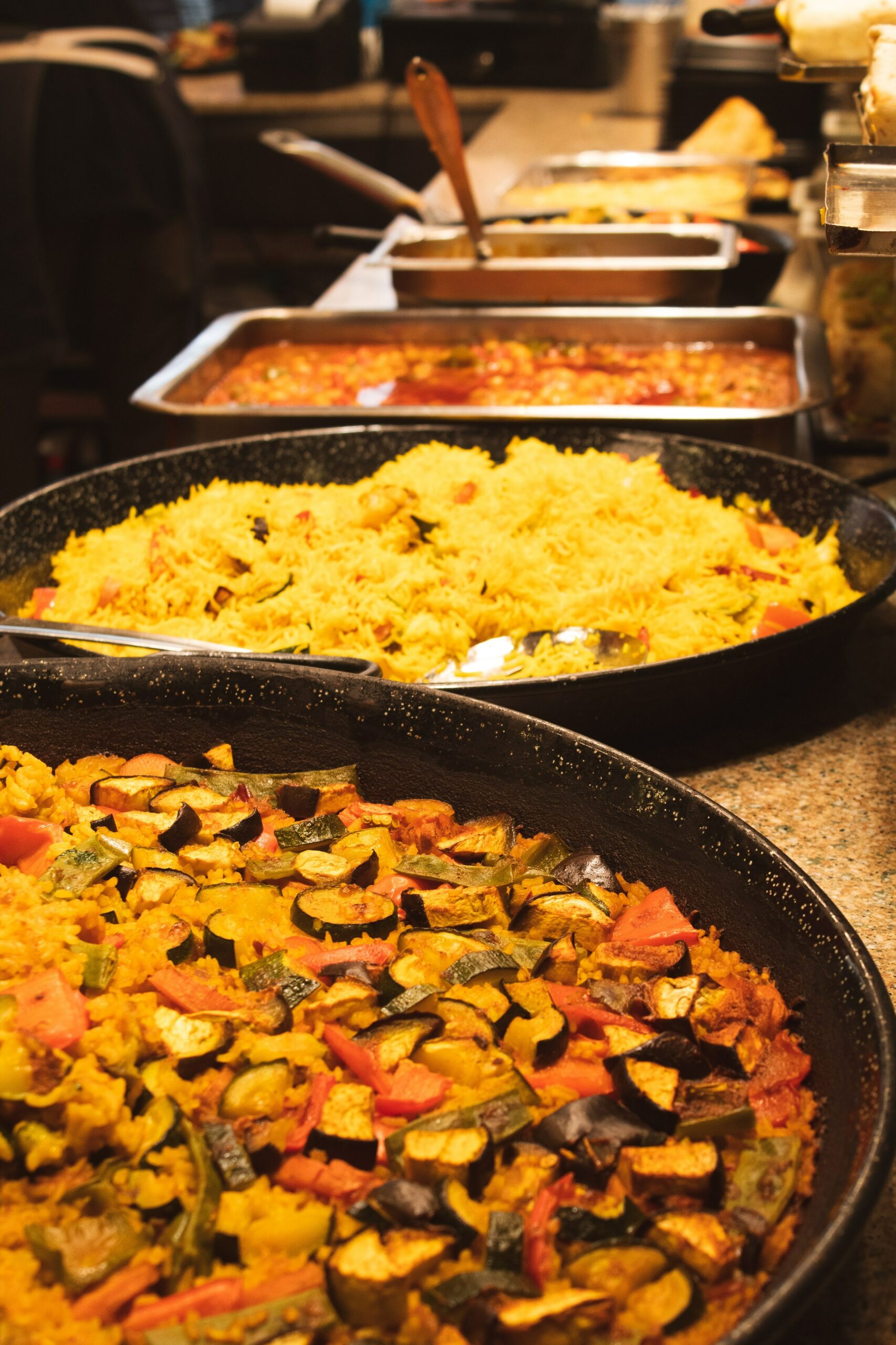 Rice dishes being cooked in La Boqueria