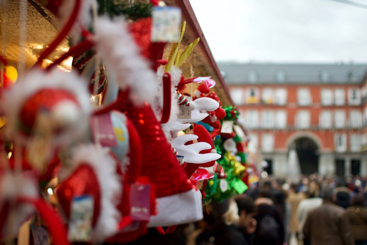 christmas hats hanging from market stall