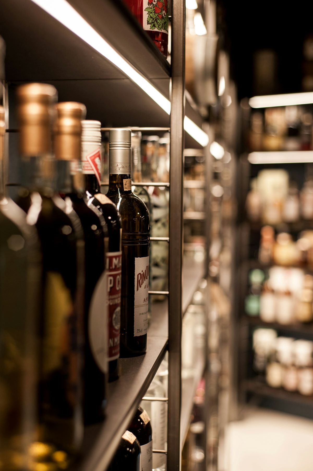 A grocery store in Portugal with Portuguese wines on shelves. 