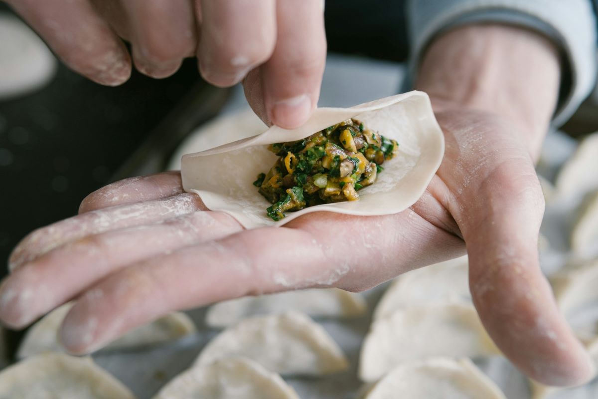 Close up of hands making Ukrainian dumplings in “Little Ukraine” in NYC. One of the hidden gems in New York you have to visit. 