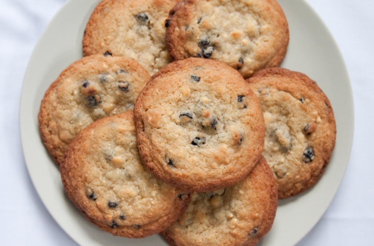 overhead shot of blueberry cookies on a white plate