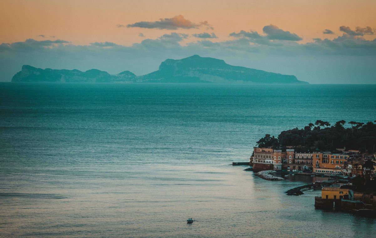 A view of the sea in Naples, Italy at sunset