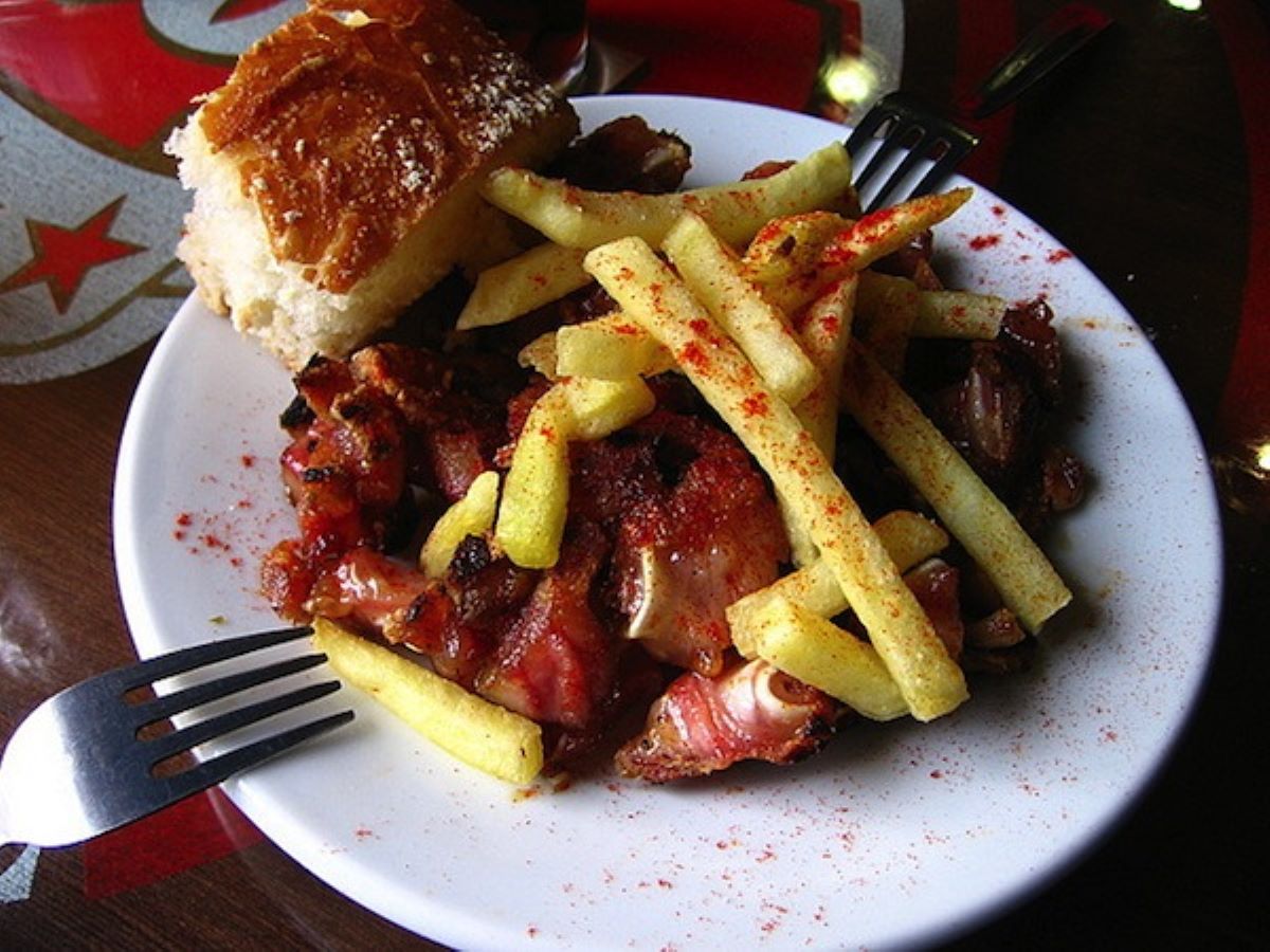 plate of potatoes and red meat