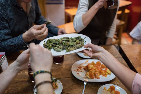 Pimientos de padrón are one of the many meatless tapas available on our vegetarian food tours in Madrid.