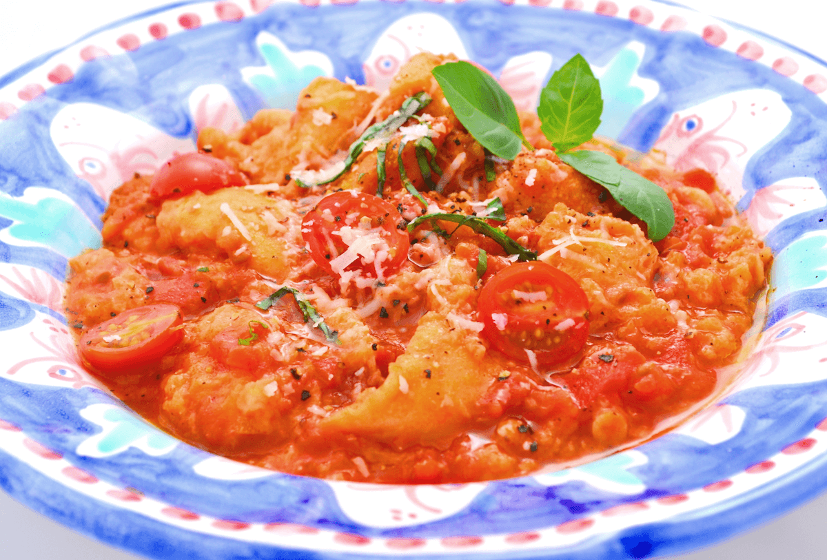 Close up of typical Tuscan tomato soup in a blue and white bowl