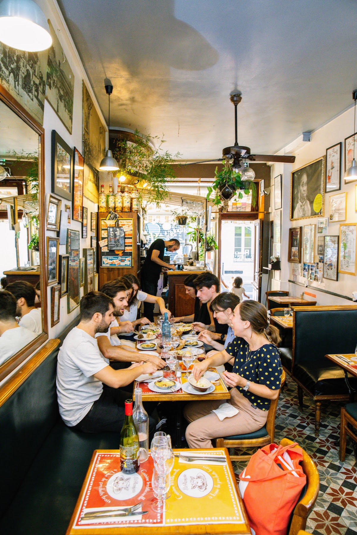 A large group of people eating a meal at a restaurant