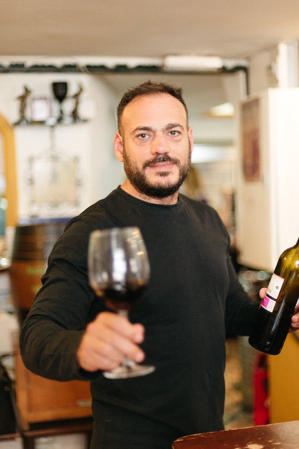 Pepe, owner of Las Golondrinas bar, with wine