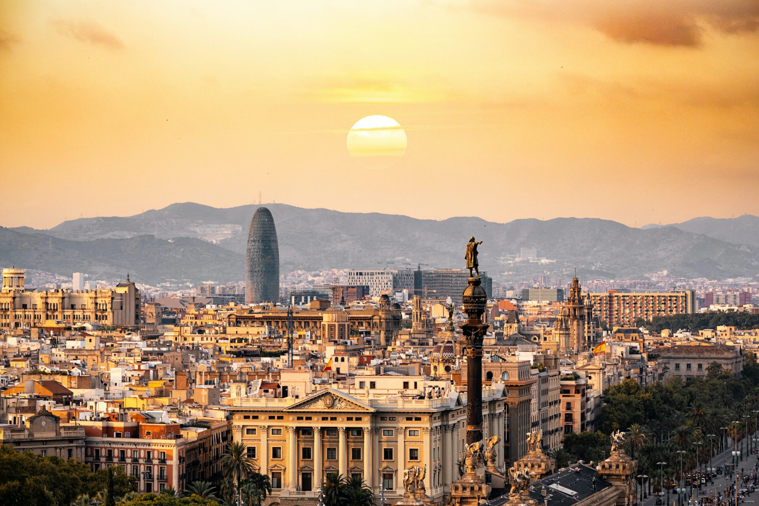 Sunset in Barcelona overlooking mountains and city skyline