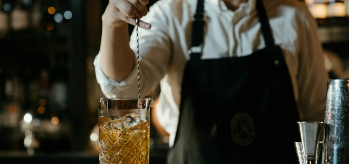 bartender stirring a drink