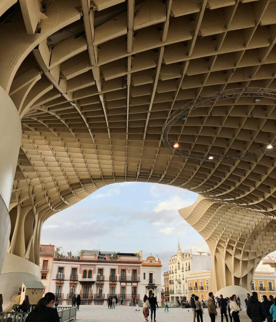 People keeping cool in Seville under the Setas monument.