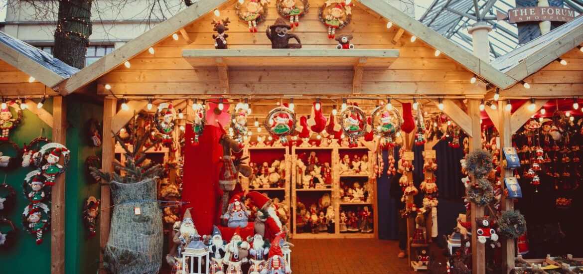 assorted plush toys at Christmas market stand