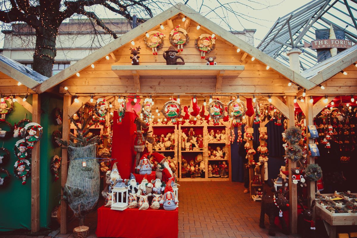 assorted plush toys at Christmas market stand