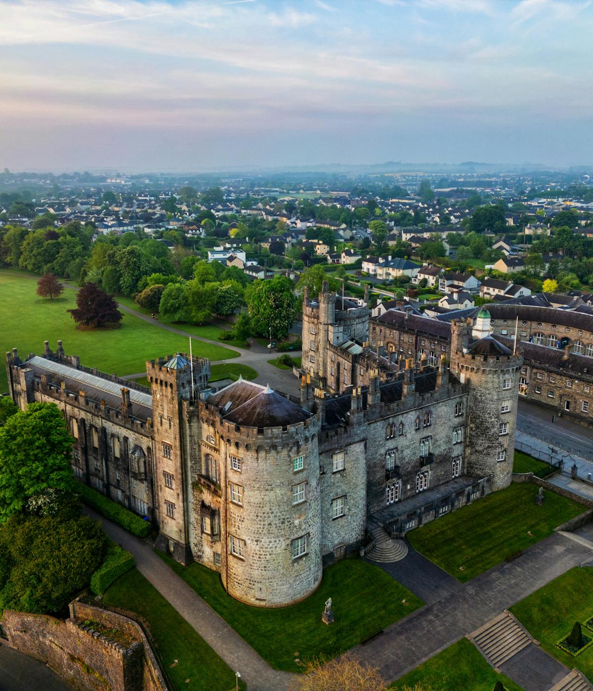 Ariel view of Kilkenny Castle at sunset. 