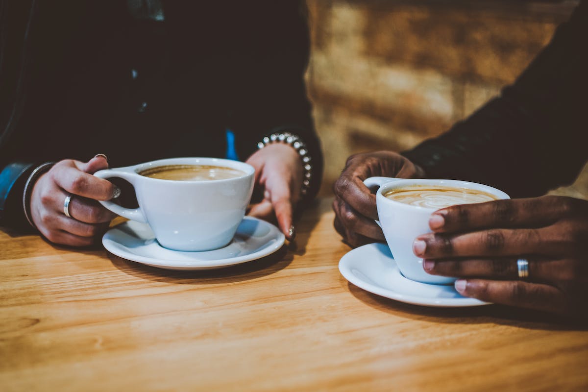 two people enjoying a caffe latte