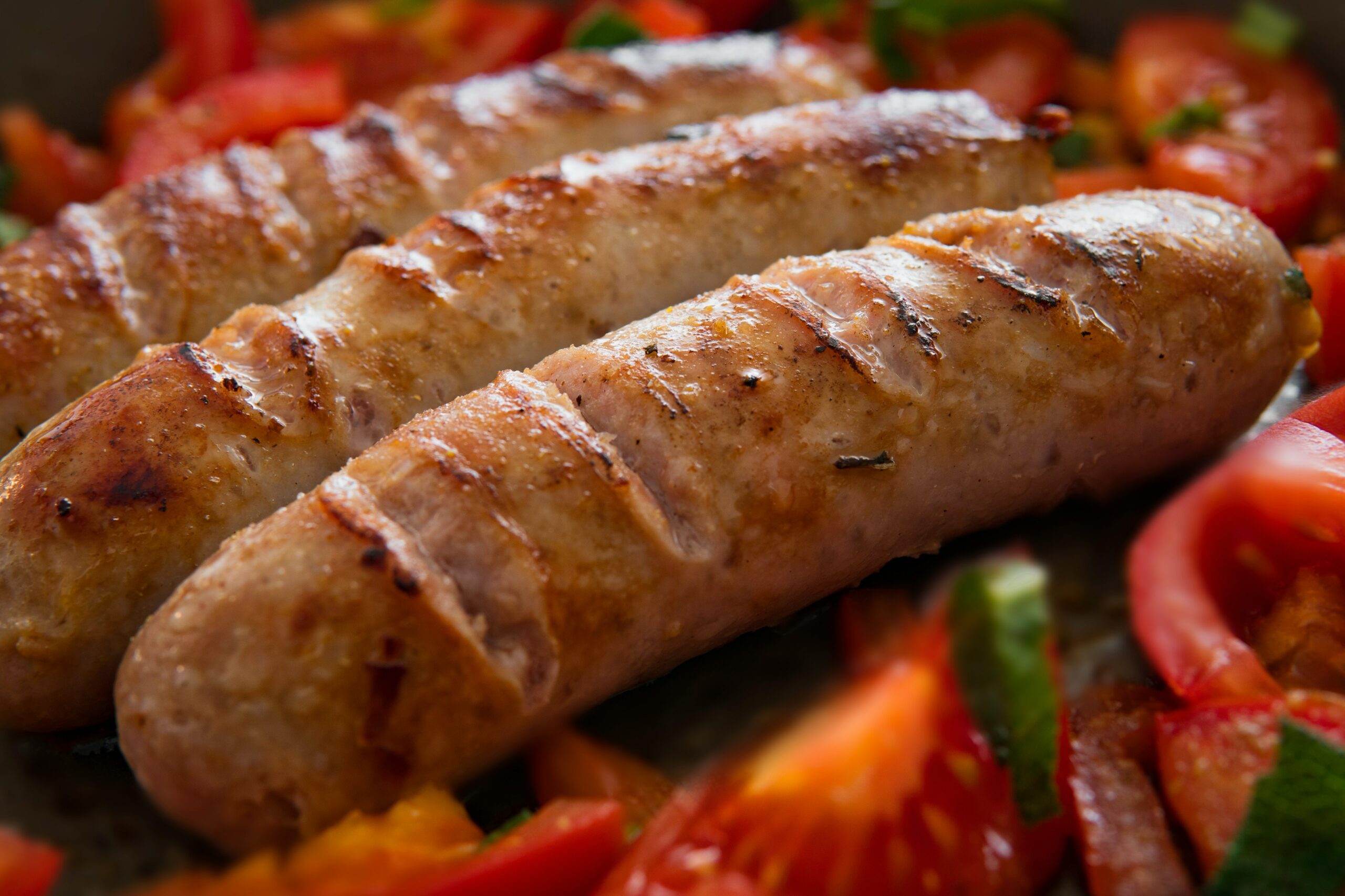 butifarra sausages  being served with tomatoes