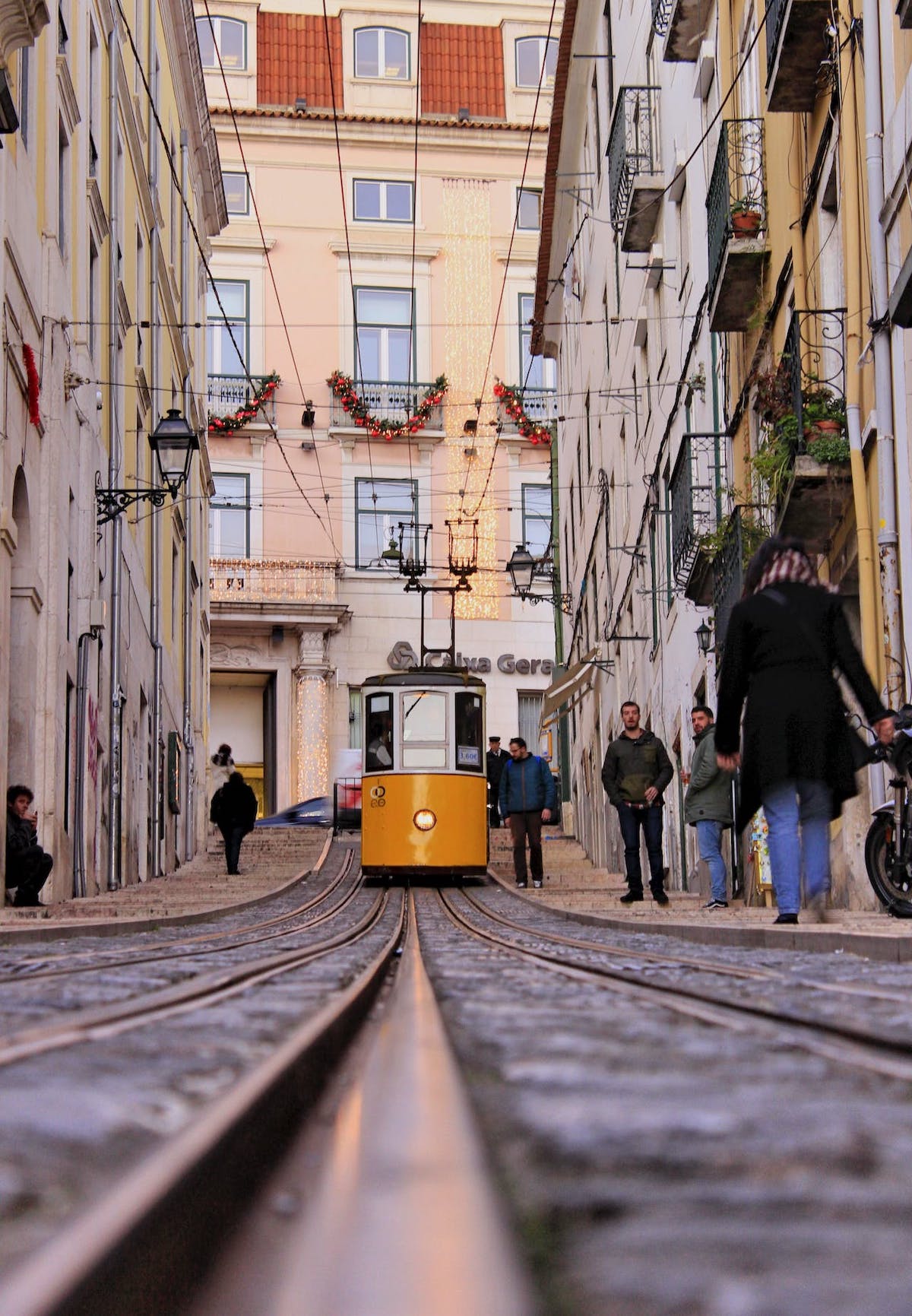 tram in lisboa with people daytime