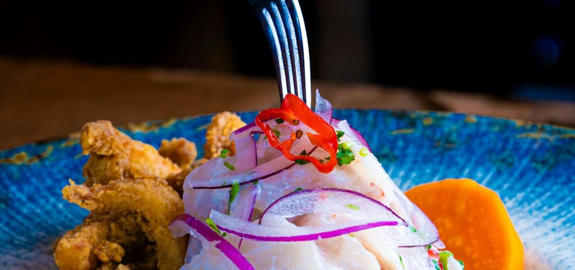 A woman eating ceviche at one of the best NYC Peruvian restaurants.