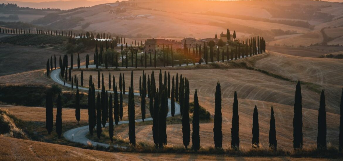 sunset over hills and winding roads