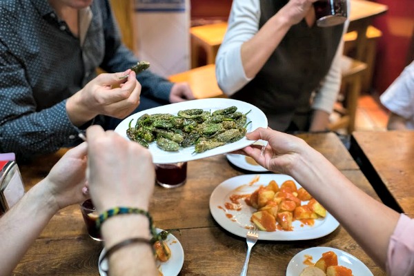 Pimientos de padrón are one of the best vegan tapas in our vegetarian guide to San Sebastian!