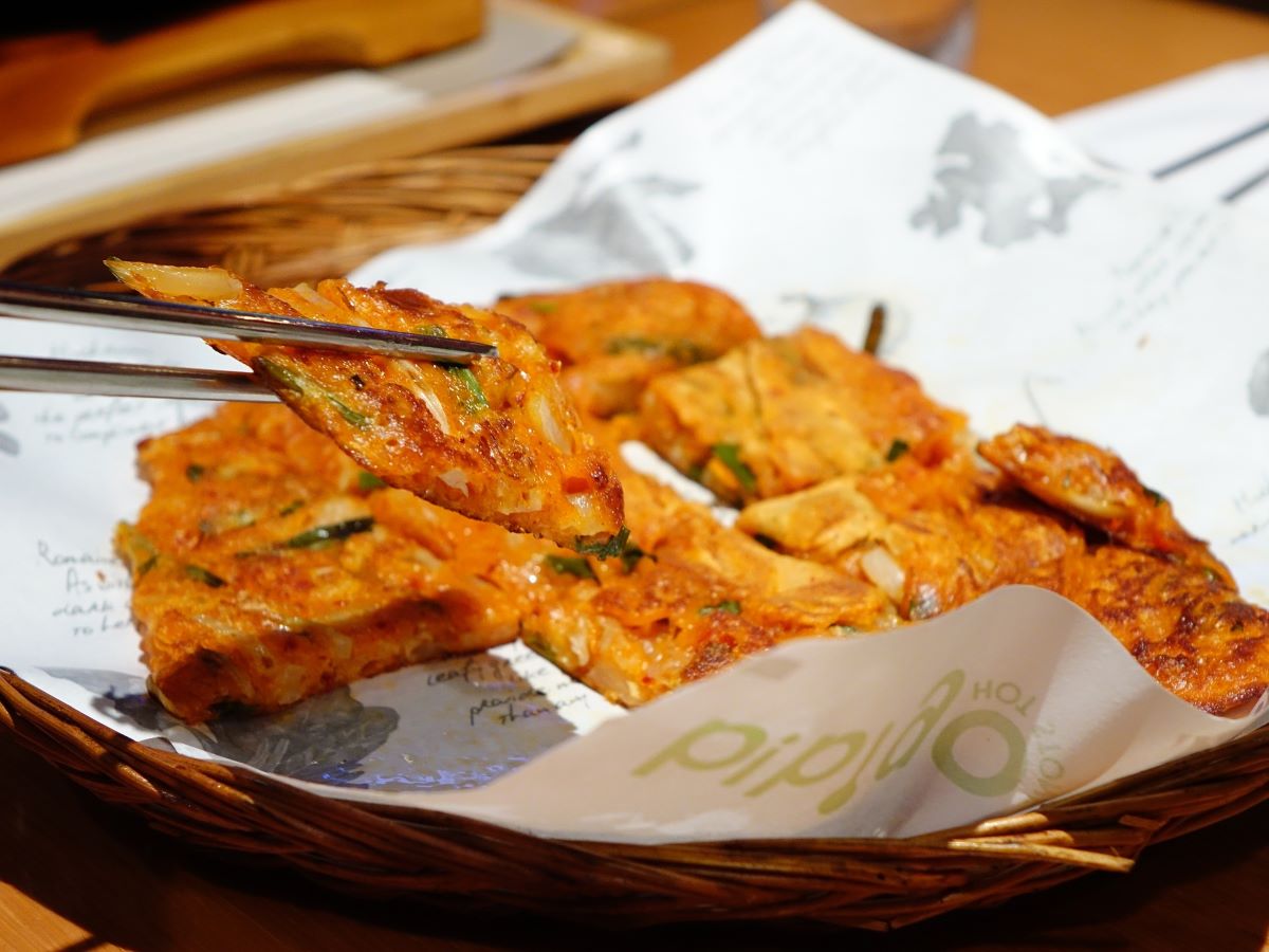 kimchi pancakes on white paper