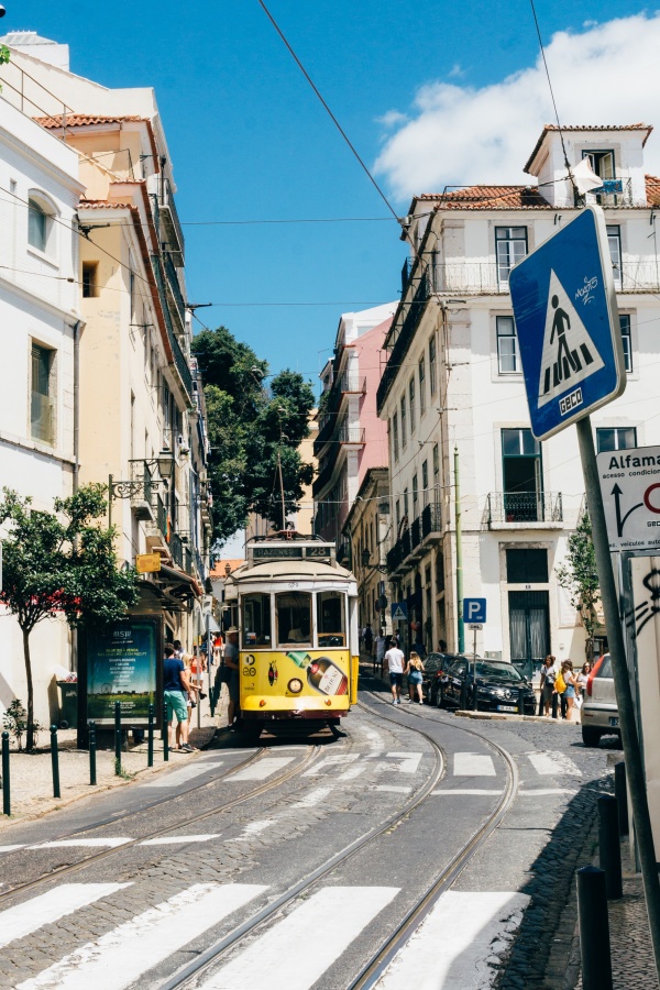 Tram 28 on a central street of the Alfama neighborhood in Lisbon
