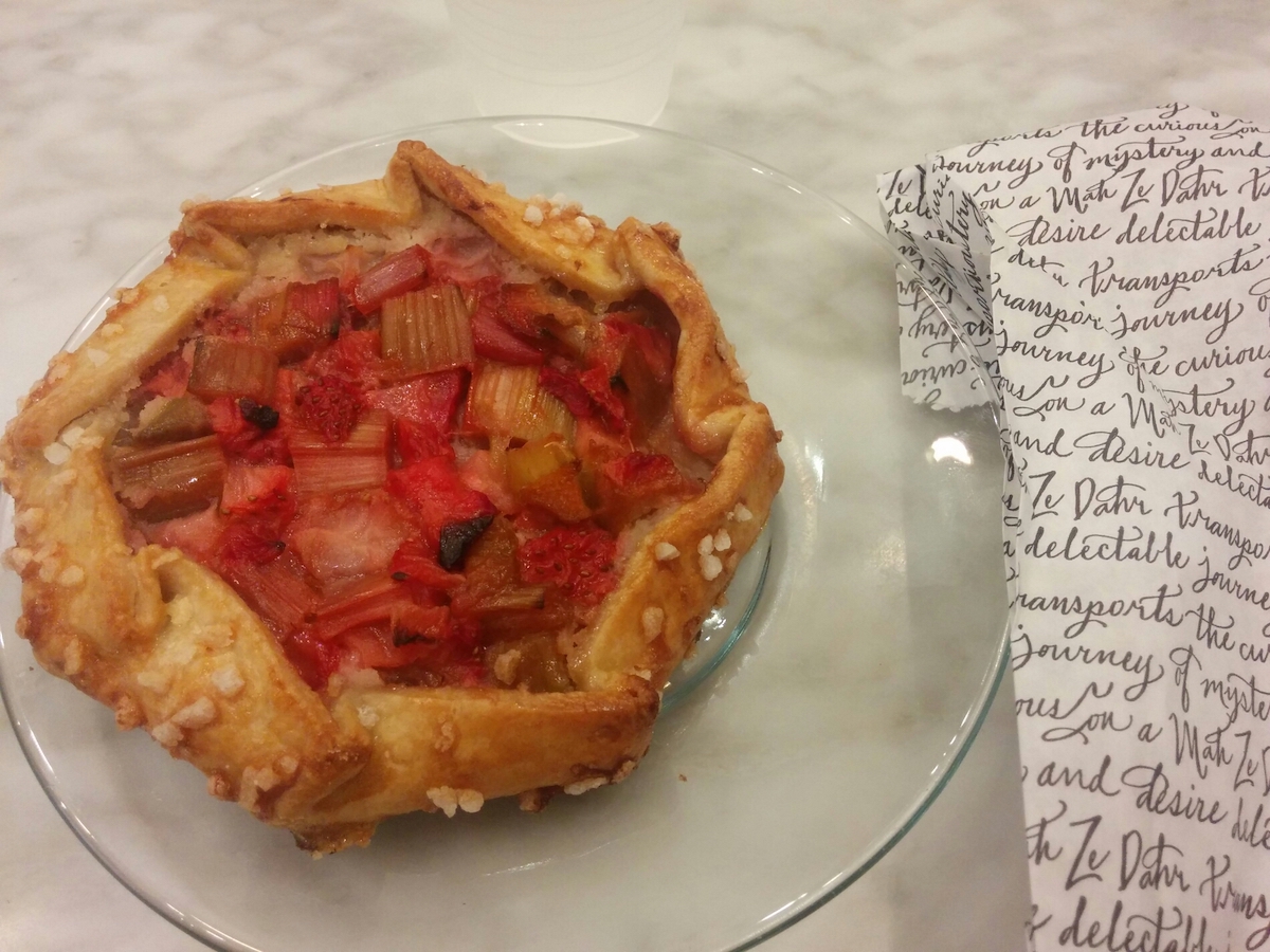 Small rhubarb tart served on a glass plate